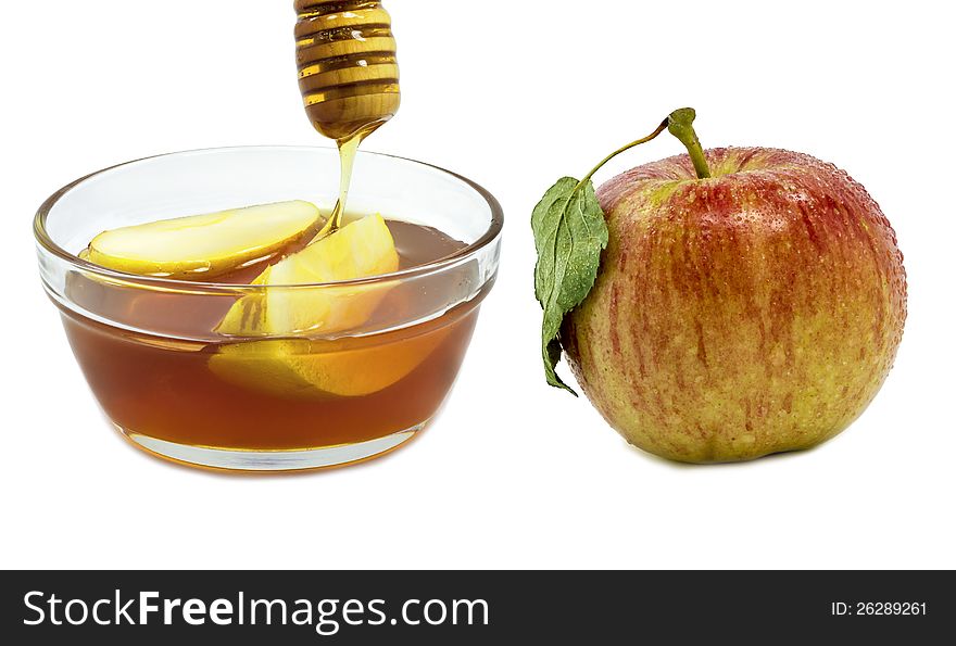 Glass With Honey And Apple Isolated On White