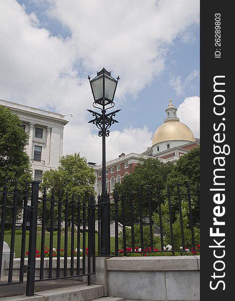 This is an old fashion lantern in front of the State House in Boston, MA. This is an old fashion lantern in front of the State House in Boston, MA