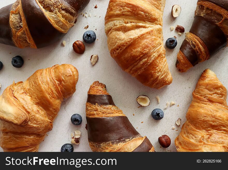 Chocolate croissants with butter and nuts