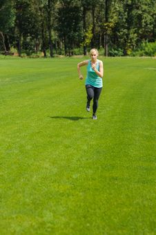 Portrait Of A Young Woman Jogging Stock Image