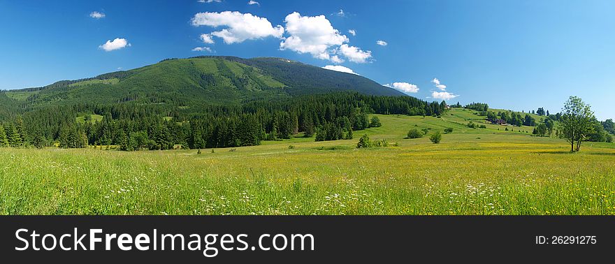 Wide-angle shot of a meadow under Babia hora mountain, at the border between Slovakia and Poland. Wide-angle shot of a meadow under Babia hora mountain, at the border between Slovakia and Poland.