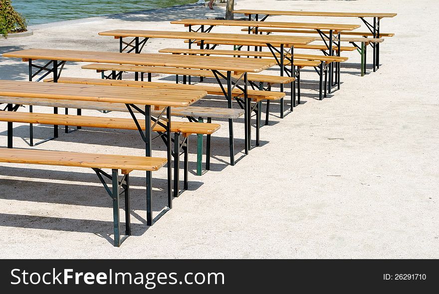 Wooden benches and tables in a row