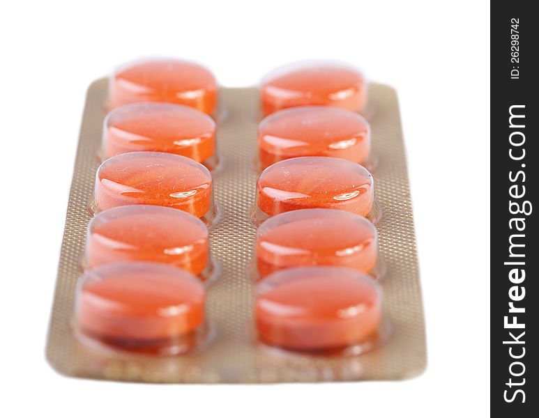 Orange pills isolated on white background. Orange pills isolated on white background