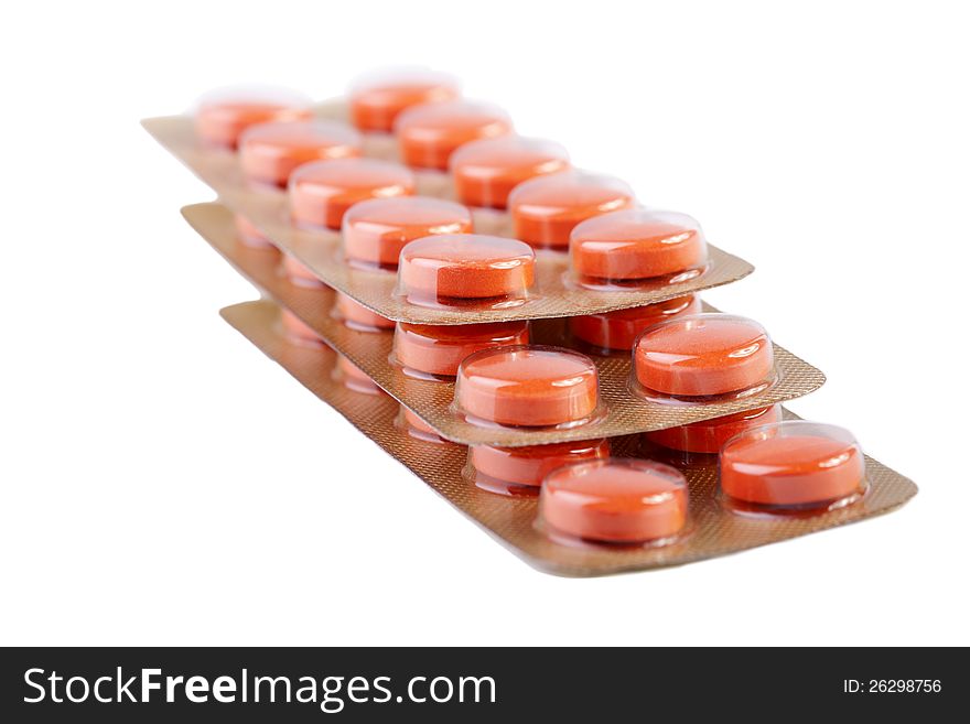Orange pills isolated on white background. Orange pills isolated on white background