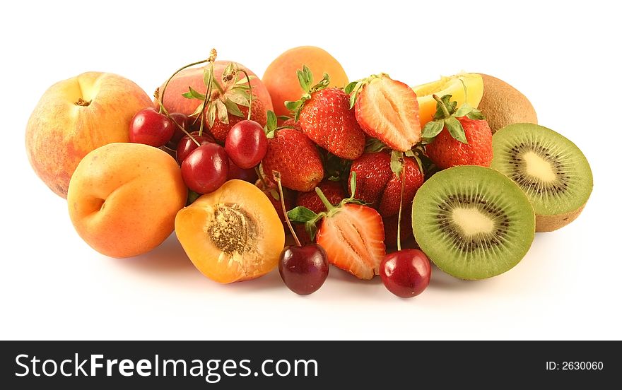 The strawberry, sweet cherry, kiwi, peaches and apricots is photographed on a white background. The strawberry, sweet cherry, kiwi, peaches and apricots is photographed on a white background