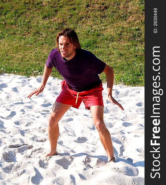 Playing beachvolleyball in the summersun