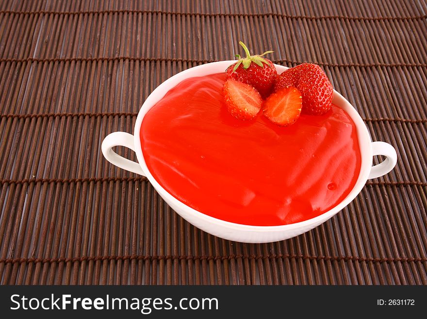 Strawberry jelly with mint leaf as garnish. Strawberry jelly with mint leaf as garnish