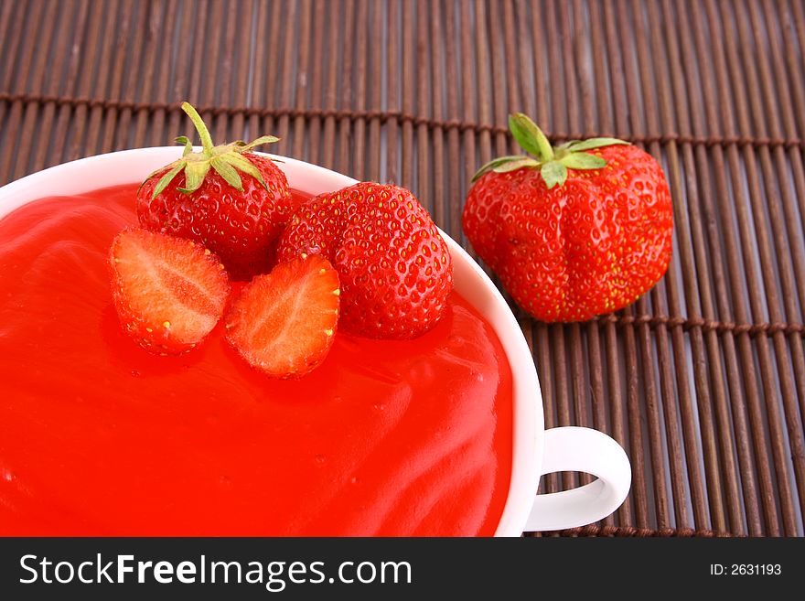 Strawberry jelly with mint leaf as garnish. Strawberry jelly with mint leaf as garnish