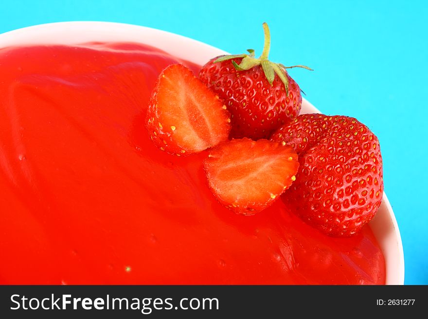 Strawberry jelly with mint leaf as garnish. Strawberry jelly with mint leaf as garnish