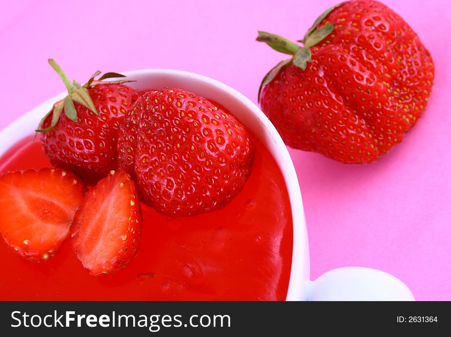 Strawberry Jam on a white background-red strawberry. Strawberry Jam on a white background-red strawberry