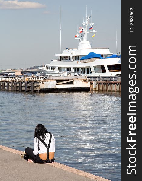 Young woman at the harbor