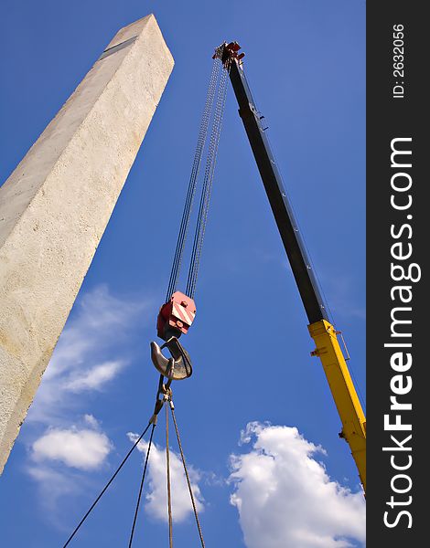 Hoisting crane on the sky. Hoisting crane on the sky