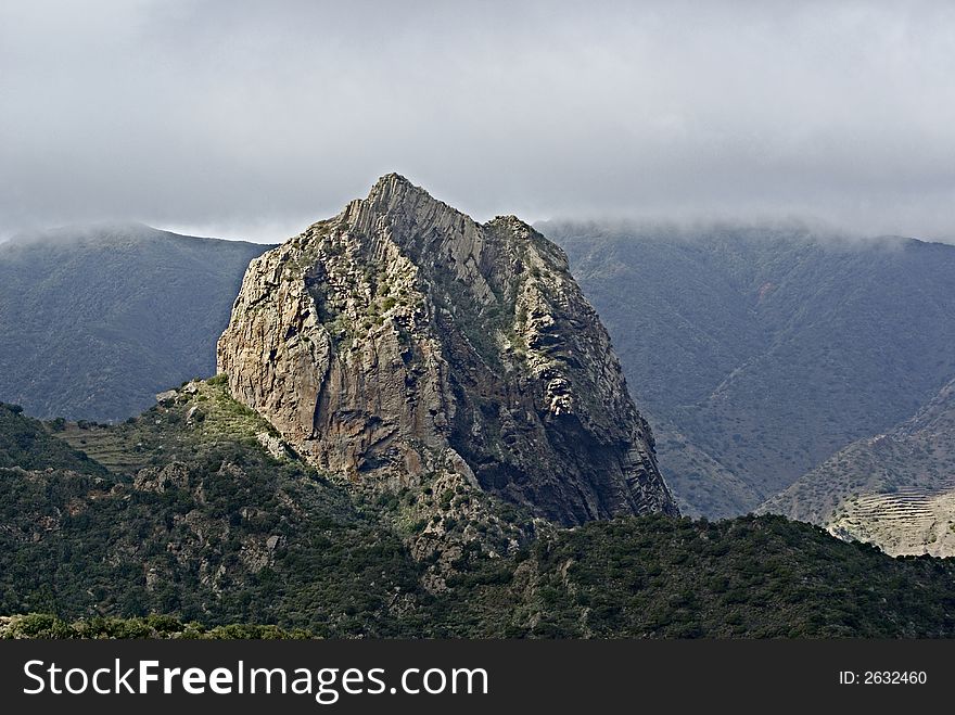 Large Rock in Gomera Mountains in front of the mist,