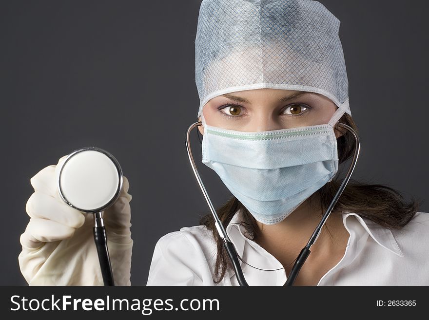 Female doctor with stethoscope about to listen to heart rate