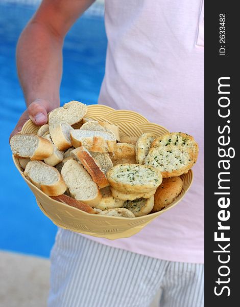 A bread basket filled with bread varieties. A bread basket filled with bread varieties