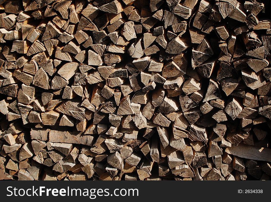 A stack of chopped wood, logs, firewood