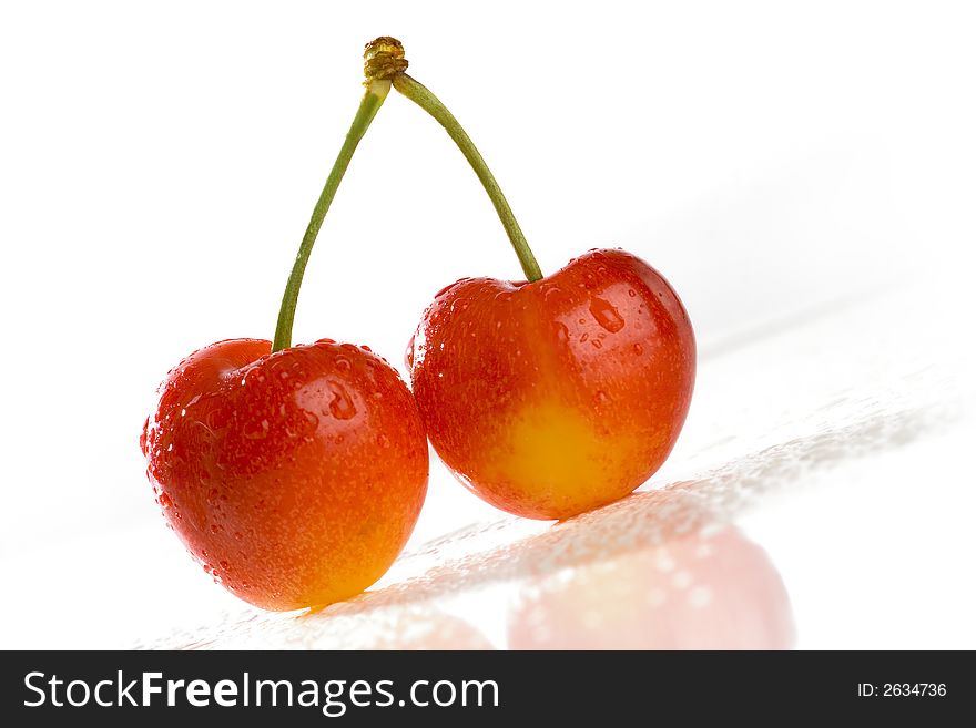 Two of Sweet Cherries with Water Drops. White background. Two of Sweet Cherries with Water Drops. White background.