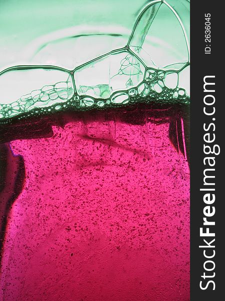Pink soap background over green. Pink soap background over green