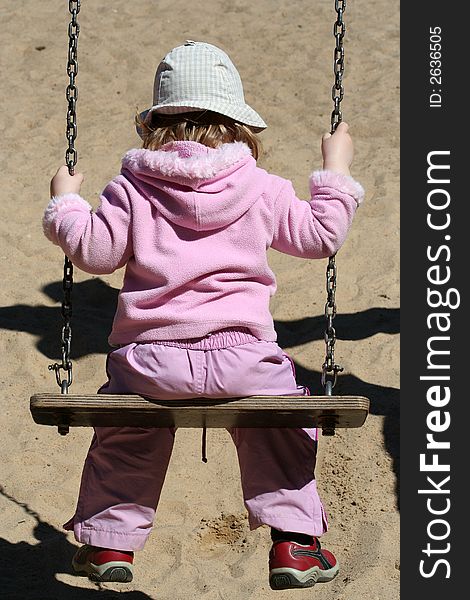 Girl on the swing, having fun