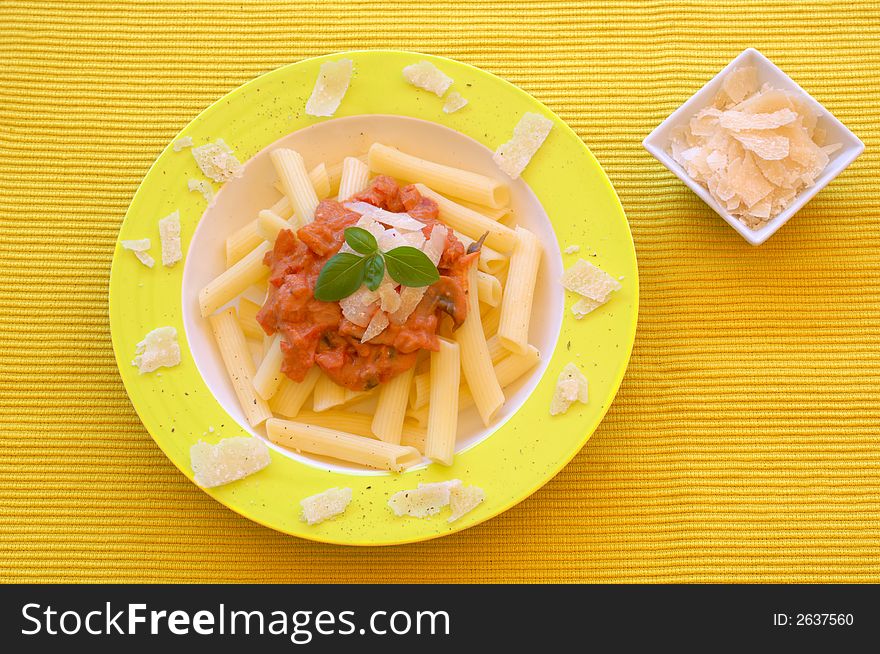 Healthy pasta garnished with parmesan, pepper and basil.