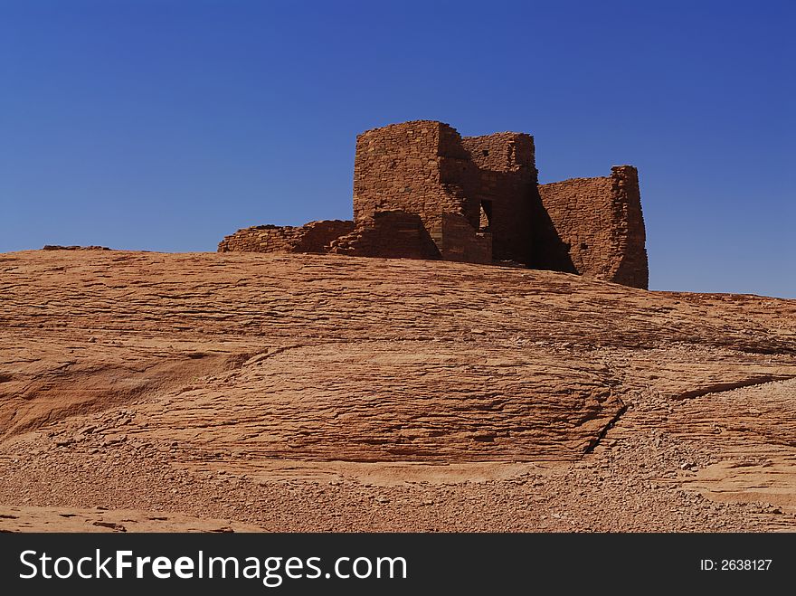The red rocks on the Wukoki indian pueblo ruins against a blue Arizona sky in Wupatki National Monument