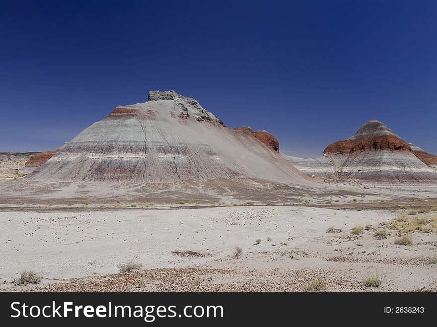 Tepee hill formats against a blue Arizona sky in the Petrified Forest National Park. Tepee hill formats against a blue Arizona sky in the Petrified Forest National Park