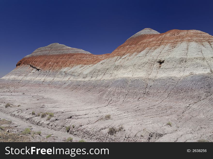 Tepee hill formats against a blue Arizona sky in the Petrified Forest National Park. Tepee hill formats against a blue Arizona sky in the Petrified Forest National Park