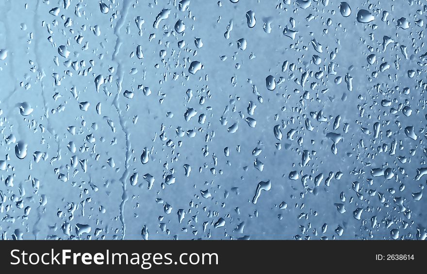 Water Drops on a metal background with blue tint
