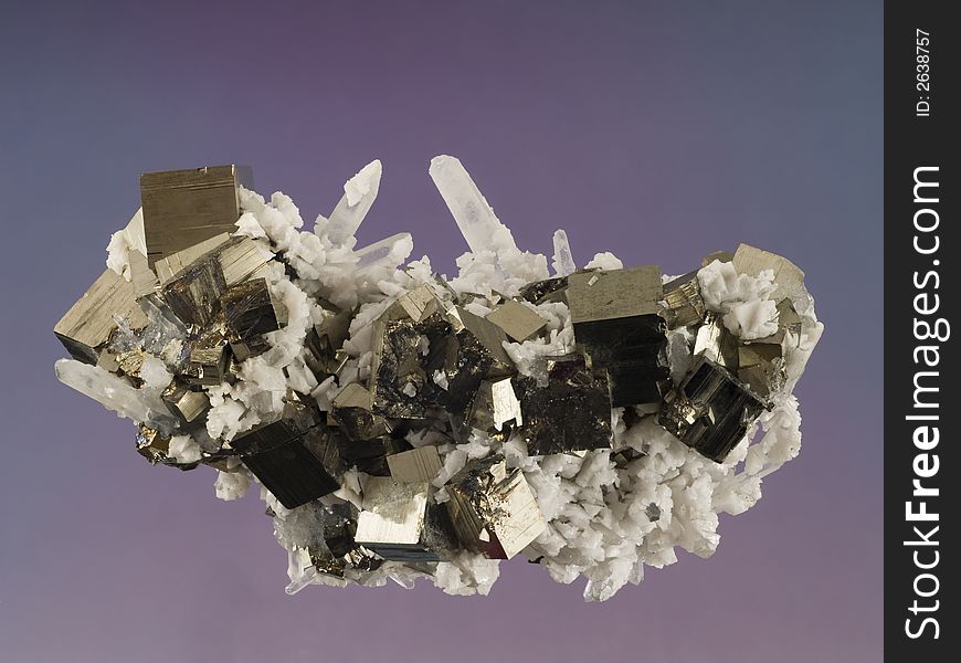 Close up of a pyrite, calcite and quartz mineral. Close up of a pyrite, calcite and quartz mineral.