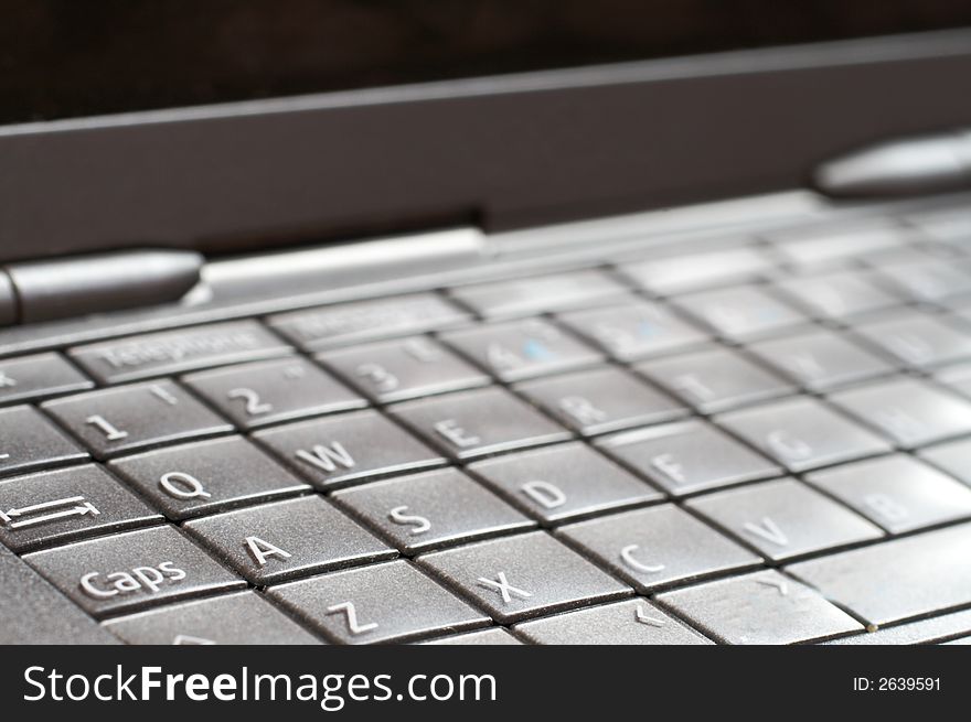 Close-up of open cellphone keyboard. Modern technology. Close-up of open cellphone keyboard. Modern technology