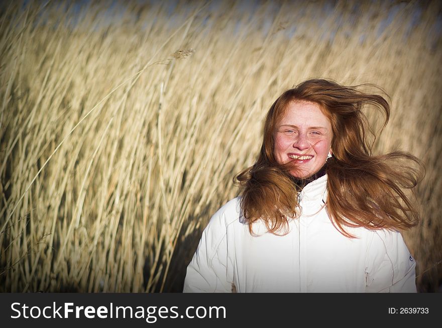 Picture of a young woman having fun outdoors. Picture of a young woman having fun outdoors