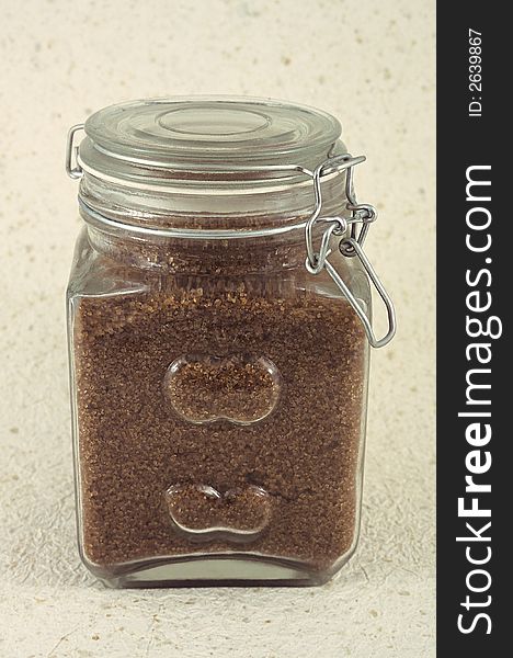 Close up of a kitchen jar with brown sugar. Close up of a kitchen jar with brown sugar