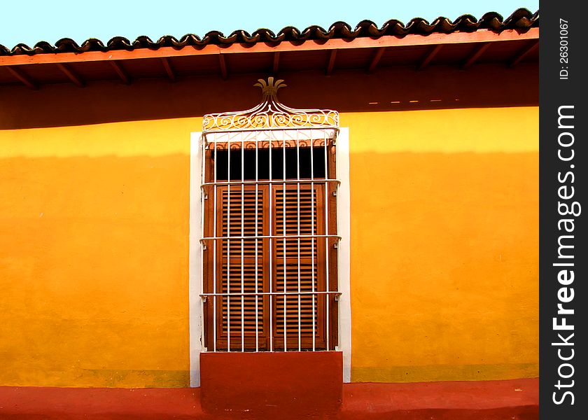 Decorative window bright with yellow walls and a roof