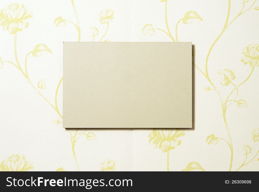 Cardboard rectangle on wallpaper with shade. In PS cardboard can be replaced easily by any other image. Cardboard rectangle on wallpaper with shade. In PS cardboard can be replaced easily by any other image.