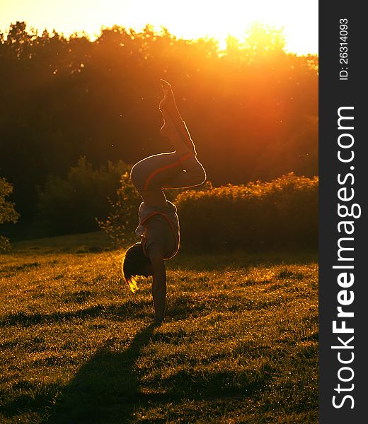 The young girl to do exercises on nature in the morning. The young girl to do exercises on nature in the morning