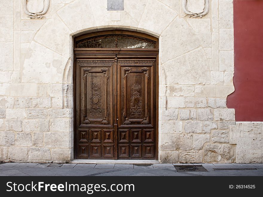 Old wooden entrance door in Valladolid, Castilla y Leon, Spain. Old wooden entrance door in Valladolid, Castilla y Leon, Spain