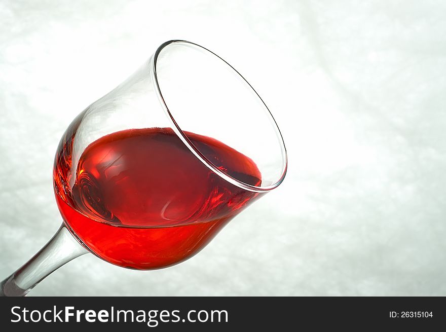 Glasses filled with red on a white background. Glasses filled with red on a white background