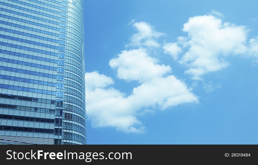 Huge skyscraper fragment with cloudy sky background. Huge skyscraper fragment with cloudy sky background