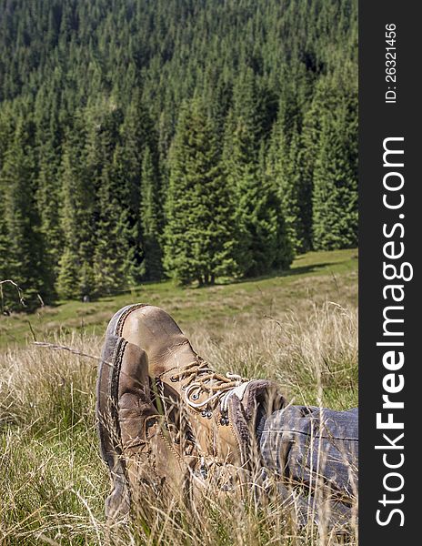 Man resting in a beautiful mountain landscape. Man resting in a beautiful mountain landscape.