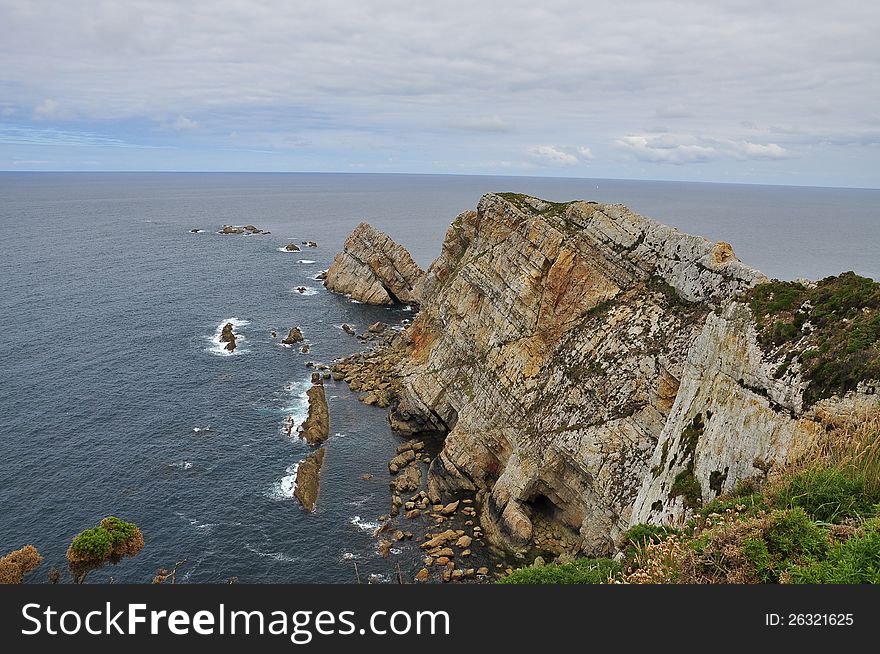 Cabo Penas. Rocky outcrop and cliff. Asturias, Atlantic Ocean, north Spanish coast. Cabo Penas. Rocky outcrop and cliff. Asturias, Atlantic Ocean, north Spanish coast.