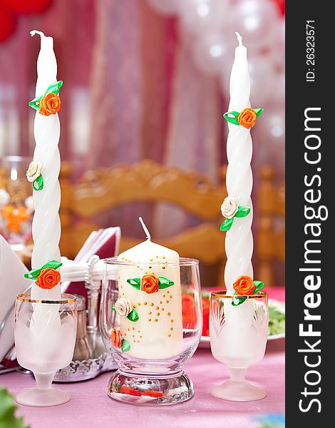 Candles In Candlesticks On A Festive Table