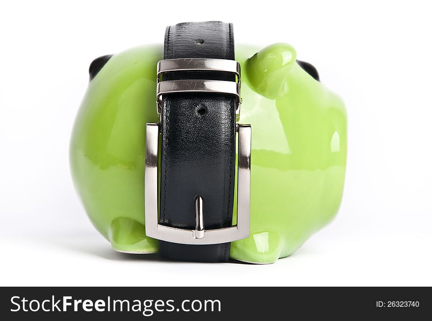 Green piggy bank with black belt around. Green piggy bank with black belt around