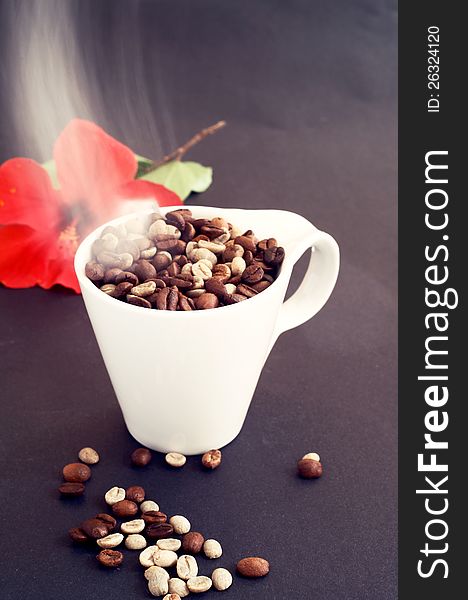 Fresh hot coffee on dark background