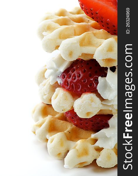 Waffles with Strawberries and Whipped Cream close up isolated on white background