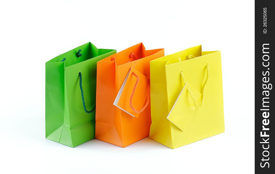 Green, Orange and Yellow Shopping Bags isolated on white background