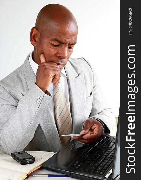 Image of a businessman looking at his card. Image of a businessman looking at his card