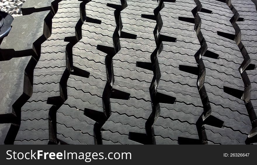 Image of the top of a super single semt truck tire tread pattern