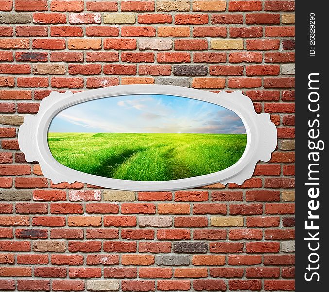 Vintage wooden frame on brick wall with field. Concept. Vintage wooden frame on brick wall with field. Concept.