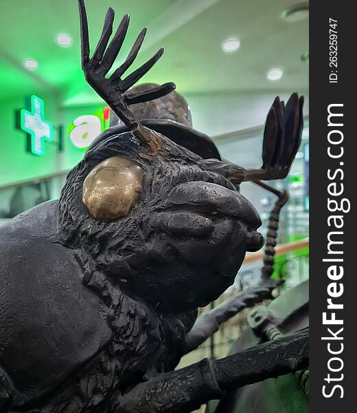 Bronze Sculpture Of A Beetle In A Hat With Rubbed Eyes