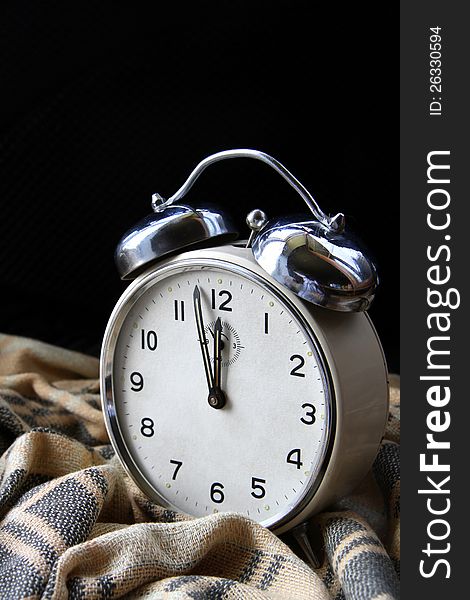 Image of a clock just about to alarm for mid night. Image of a clock just about to alarm for mid night